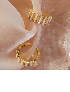 Detail of vintage 18K gold plated wide ring with pearls and pavé set rhinestones