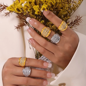 Elegant multi-layer wide band ring with sparkling pavé crystals in gold and silver finish