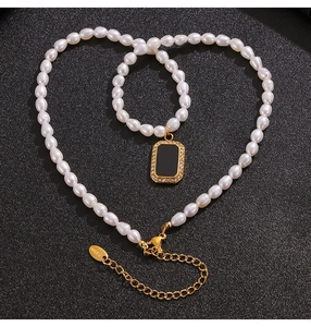 Detail of baroque pearl necklace and bracelet set with black zircon pendant and S.Steel tag