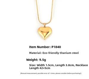 Detailed view of gold heart pendant with 18k plating and 42+5cm snake chain dimensions