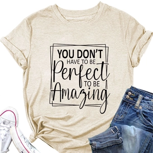 Flat lay of beige T-shirt with 'You don't have to be perfect' print and casual outfit