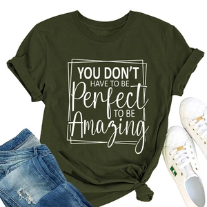Detail view of olive green cotton T-shirt with white motivational text and denim styling
