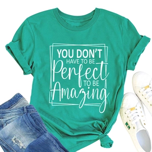 Flat lay of green cotton crewneck T-shirt with white motivational quote print