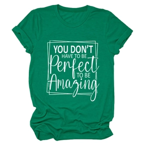 Macro shot of green cotton t-shirt with white motivational quote printed on chest