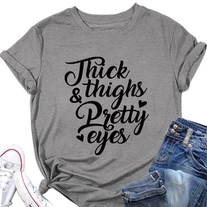 Flat lay of gray cotton T-shirt with Thick & Thighs print and knotted hem detail