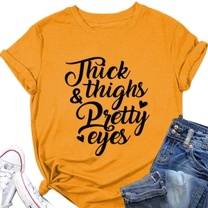 Flat lay of yellow cotton t-shirt with black letter print paired with blue denim jeans