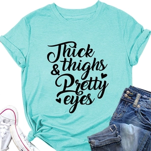 Detail of mint green t-shirt with black art print and stylish side knot design