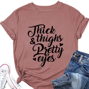 Detail of Thick Thighs Pretty Eyes slogan print on a casual mauve crew neck t-shirt