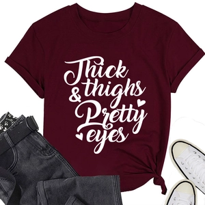 Detail of burgundy T-shirt with Thick thighs Pretty eyes slogan and side knot tie