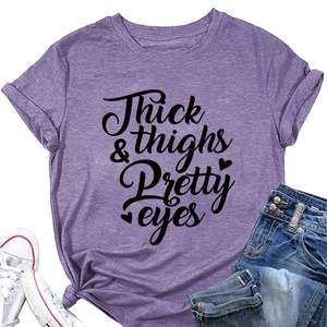 Detail of purple graphic tee with Thick & Thighs print and knotted hem design