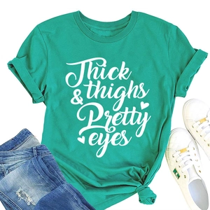 Flat lay of a turquoise t-shirt with Thick thighs & Pretty eyes print and knotted hem