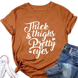 Detail of ginger orange T-shirt with Thick & Thighs script print and rolled cuffs
