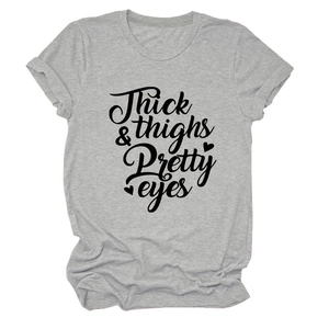 Close-up of Thick Thighs Pretty Eyes print on grey casual cotton short sleeve t-shirt