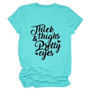 Detail of cyan crewneck T-shirt featuring black Thick thighs & Pretty eyes cursive print
