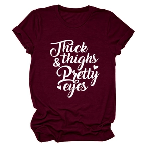 Detail shot of maroon t-shirt featuring thick thighs pretty eyes artistic script print