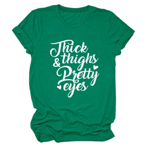 Detail of dark green cotton T-shirt featuring white Thick Thighs & Pretty Eyes print