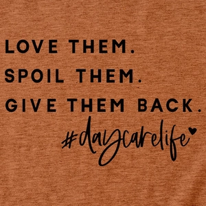 Close-up of Love Them Spoil Them text on rust heather texture short sleeve t-shirt