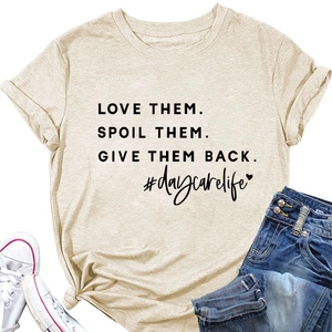 Flat lay of women's round neck T-shirt with 'LOVE THEM' slogan, jeans and white shoes