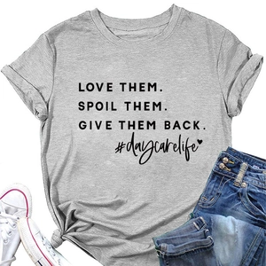 Detail of grey crewneck T-shirt with LOVE THEM. SPOIL THEM. print and #daycarelife tag
