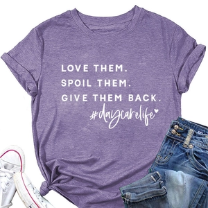 Detail of purple cotton T-shirt with white letter print and stylish knot hem design