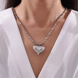 Hollow heart pendant necklace with quilted texture and beaded chain for women