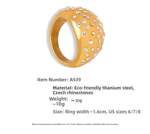 Detail of 18k gold plated titanium steel wide ring featuring inlaid crystals and 1.6cm width