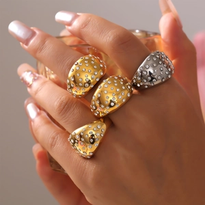 Polished wide geometric ring in gold and silver with sparkling round zircon accents