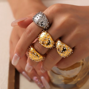 Set of four 18k gold and silver thick dome rings with sparkling pave zircon stones