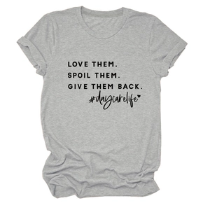 Detail of grey crewneck T-shirt with LOVE THEM. SPOIL THEM. printed text and cotton texture