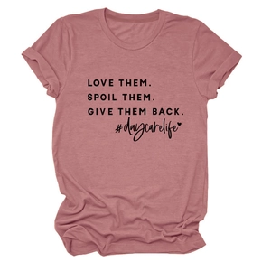 Close-up of daycarelife slogan print on pink cotton short sleeve t-shirt detail