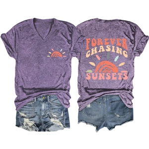 Detail of V-neck t-shirt with Forever Chasing Sunsets print and ripped denim shorts