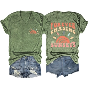 Back view of green V-neck T-shirt with Forever Chasing Sunsets print and denim shorts