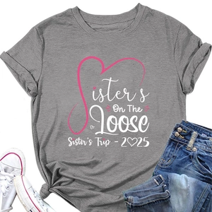 Flat lay of gray cotton T-shirt featuring Sisters On The Loose print with denim shorts