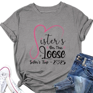 Detailed view of gray Sisters On The Loose T-shirt with pink hearts and 2025 graphic