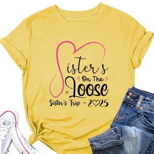 Detail of yellow cotton T-shirt featuring Sisters On The Loose print and heart graphic