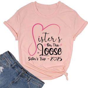Detailed view of pink crew neck T-shirt featuring Sister's Trip 2025 graphic print