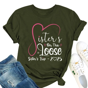 Detail of olive green t-shirt featuring Sisters On The Loose and 2025 trip print