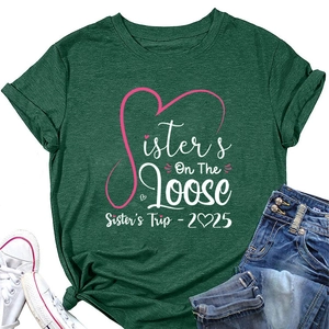 Detail of dark green t-shirt with pink Sisters On The Loose print and knotted hem
