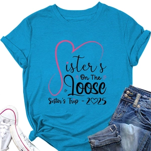 Flat lay of blue cotton T-shirt featuring Sisters On The Loose 2025 graphic print