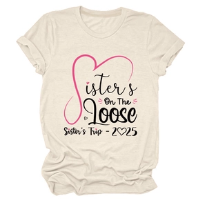 Detail of Sisters On The Loose print on cream cotton T-shirt for sisters trip 2025