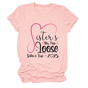 Close-up of light pink cotton t-shirt featuring Sister's On The Loose 2025 graphic print