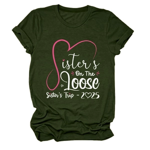 Flat lay of dark green T-shirt featuring pink Sister's Trip 2025 graphic print