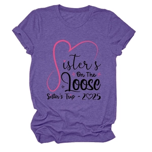 Detailed flat lay of a heather purple t-shirt featuring Sisters Trip 2025 graphic print