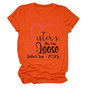 Detailed flat lay of orange crew neck T-shirt with black Sisters On The Loose print