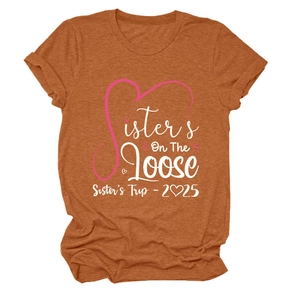 Detailed flat lay of a caramel brown t-shirt featuring Sister's On The Loose graphic design
