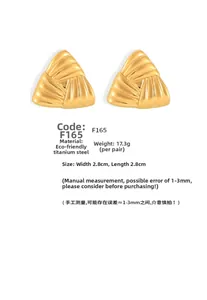 Macro detail of gold plated triangle earrings with striped texture and dimensions