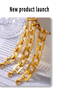 Detailed close-up of 18k gold plated stainless steel square link chain with lobster clasp