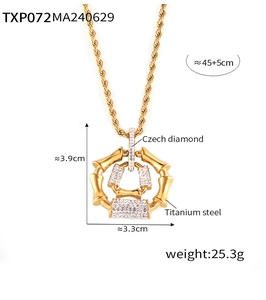 Detailed close-up of 18k gold plated titanium steel bamboo necklace with crystals