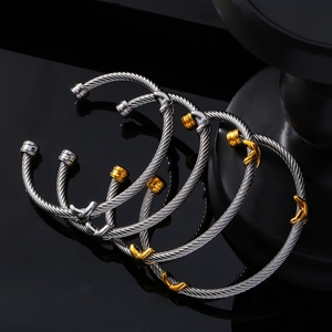 Minimalist stainless steel cable twist open cuff bracelets in silver and gold accents