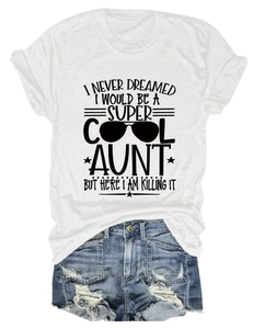 Flat lay of cotton slogan T-shirt and distressed denim shorts on white background